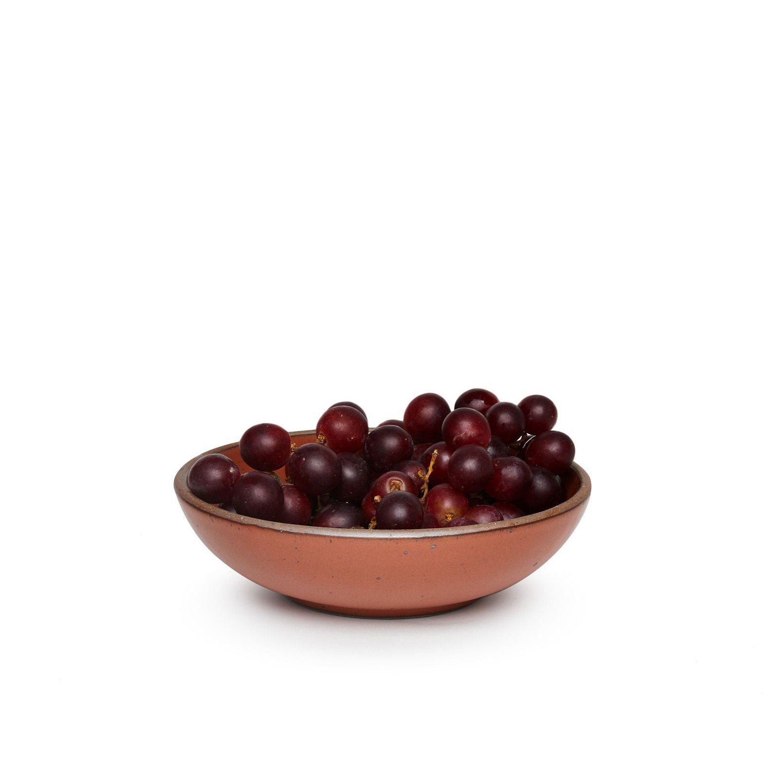 Vella Supply daily bowl in Terracotta, shown with grapes