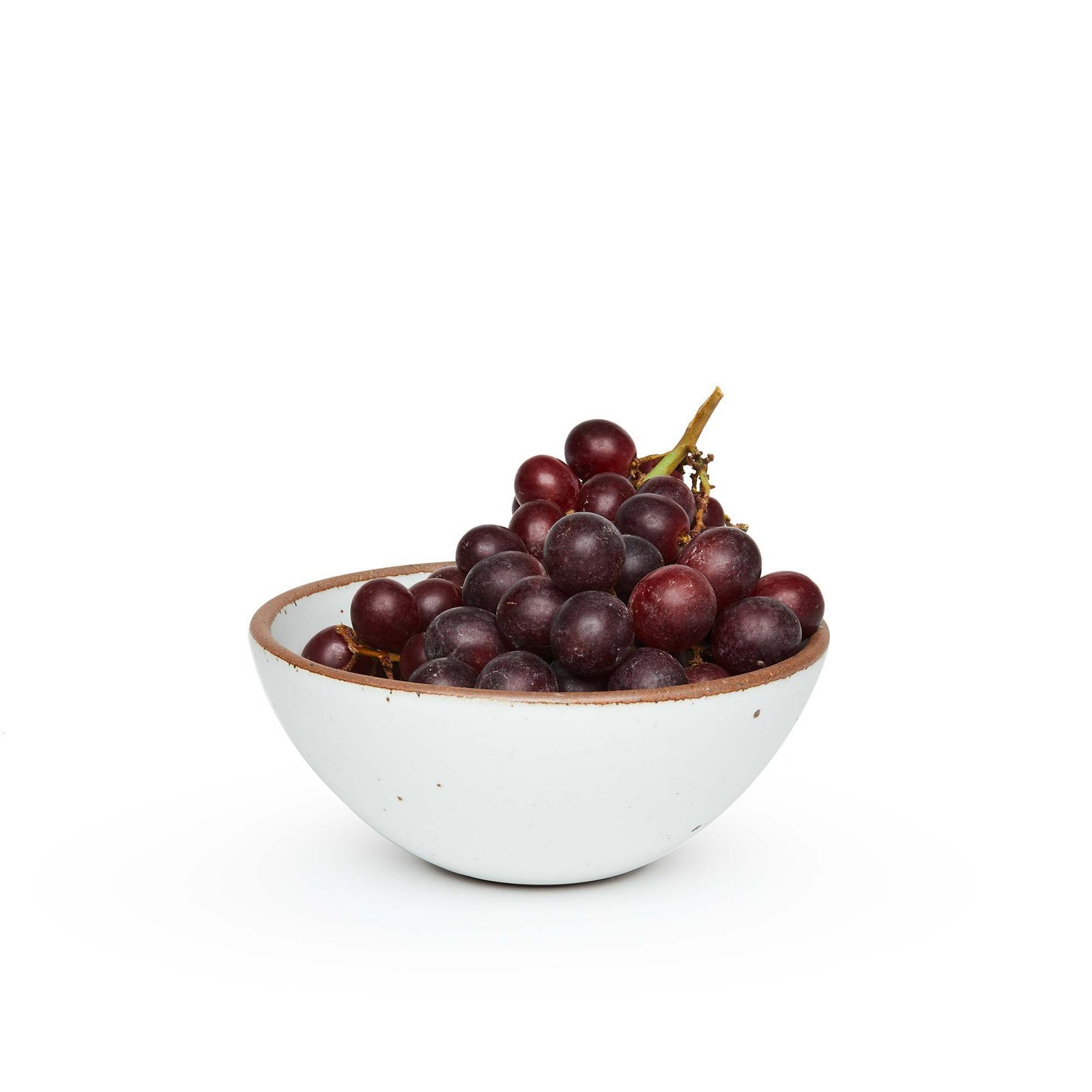 Vella Supply soup bowl in Cloud White, shown with grapes